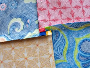 Close-up of seams spun on back of block