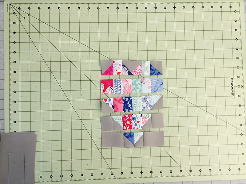 Assemble patchwork heart pieces into rows